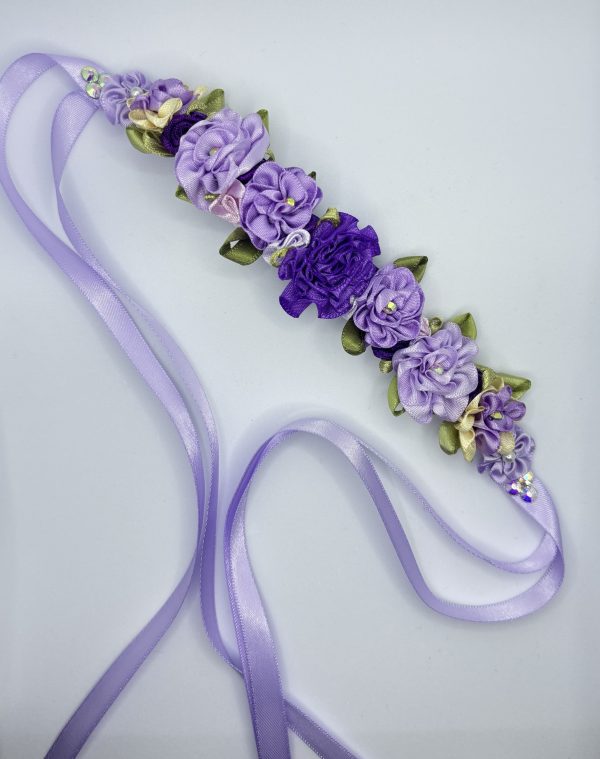 Beautiful handmade mixed of purple flowers blooming on the lace Ballet bun wrap