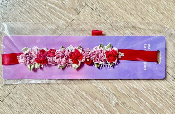 Beautiful handmade mixed of pink and red flowers blooming Ballet Bun Wrap